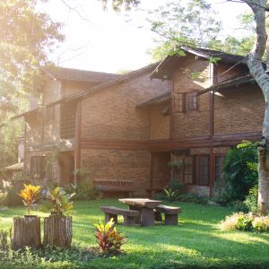 House build brick and wood in countryside. soft flare sunlight.