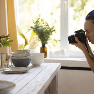 woman-taking-photos-ceramic-kitchenware